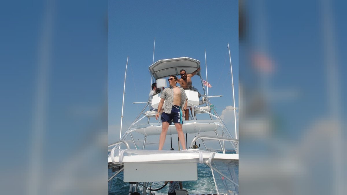 Guests riding on the bow of a private yacht on the way to a snorkeling stop in Banderas Bay