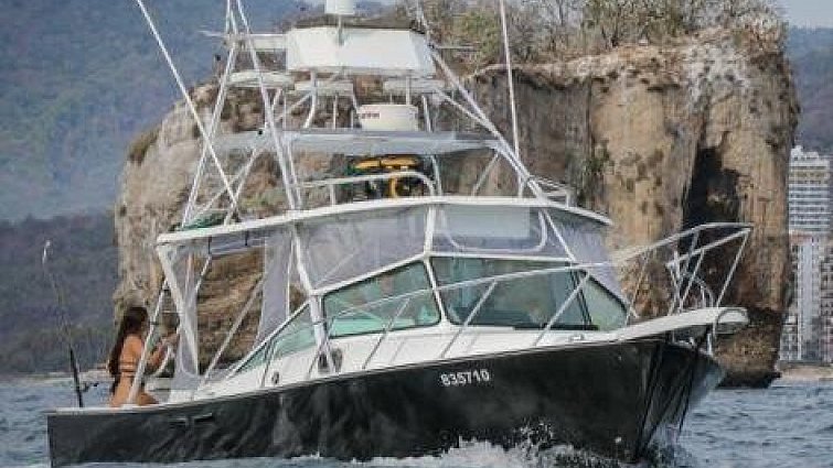 Guanatuna at the rock arches of Los Arcos National Marine Park on a snorkeling charter from Nuevo Vallarta