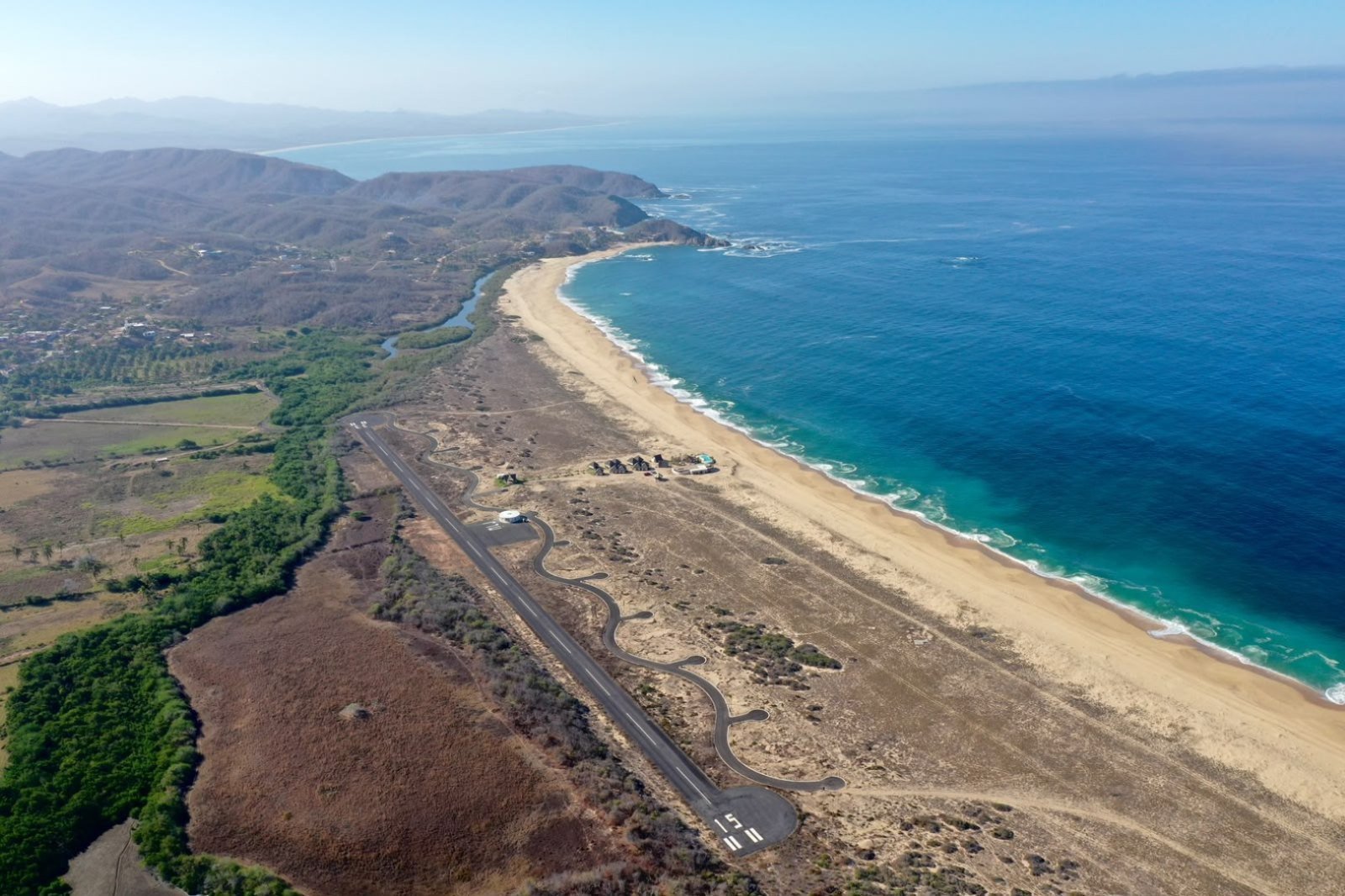 Aerial view of the Mayto airstrip running parallel to the beach in Costalegre, Jalisco