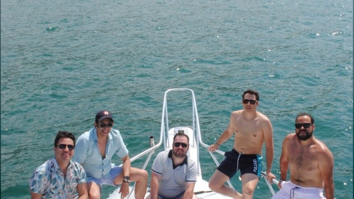 Group of friends on the bow of a private boat after snorkeling in Banderas Bay, Puerto Vallarta